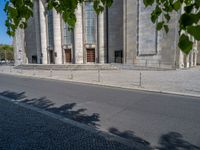 an entrance of a building with large columns and doors that spell out the word voltege