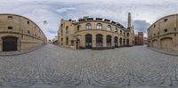 360 viewing of a cobbled street in a historical city area near a church on a hill