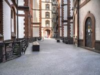 the view down the alley way into the building from the entrance to the courtyard area