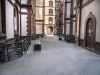 the view down the alley way into the building from the entrance to the courtyard area