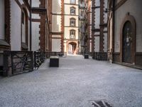 the view down the alley way into the building from the entrance to the courtyard area