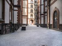 the view down the alley way into the building from the entrance to the courtyard area