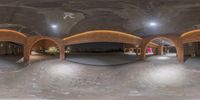 this is the 360 view of a building from underneath it there are people walking around