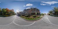 a panoramic image shows a street in front of a building in an apartment complex