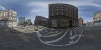 this is a 360 - shot of the street of a city on an overcast day