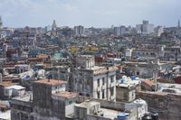 a large city with old buildings, some with red roofs and lots of other buildings