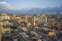 a large city with old buildings, some with red roofs and lots of other buildings