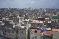 a large city with old buildings, some with red roofs and lots of other buildings