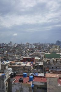 a large city with old buildings, some with red roofs and lots of other buildings