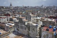 a large city with old buildings, some with red roofs and lots of other buildings