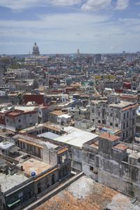 a large city with old buildings, some with red roofs and lots of other buildings