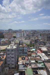 a large city with old buildings, some with red roofs and lots of other buildings