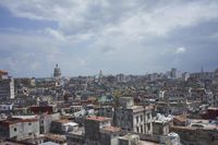 a large city with old buildings, some with red roofs and lots of other buildings