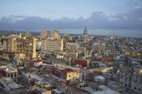 a large city with old buildings, some with red roofs and lots of other buildings