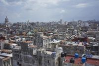 a large city with old buildings, some with red roofs and lots of other buildings