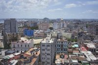 a large city with old buildings, some with red roofs and lots of other buildings