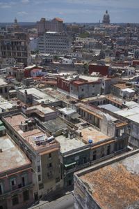 a large city with old buildings, some with red roofs and lots of other buildings