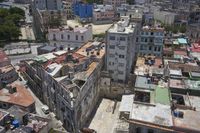 a large city with old buildings, some with red roofs and lots of other buildings