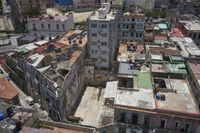 a large city with old buildings, some with red roofs and lots of other buildings