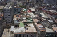 a large city with old buildings, some with red roofs and lots of other buildings