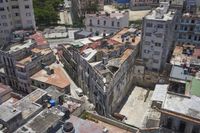 a large city with old buildings, some with red roofs and lots of other buildings