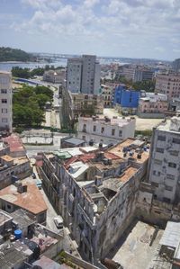 a large city with old buildings, some with red roofs and lots of other buildings