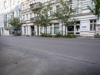 a city street in front of a bunch of building with an old sign reading hotel