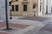 a corner with several stop lights at a city intersection and a red light at the intersection