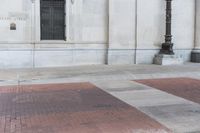 an image of a corner at a bank building with a fire hydrant on it's side