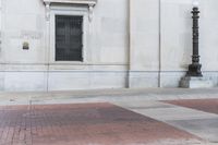 an image of a corner at a bank building with a fire hydrant on it's side