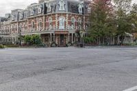 an old, brick hotel on a corner street in downtown victoria bchjt