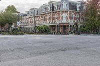 an old, brick hotel on a corner street in downtown victoria bchjt