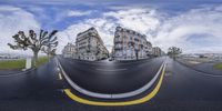 there is an image of two big buildings in the same perspective of a small curved road