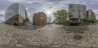 a couple of tall buildings are shown in a fish eye lens of the same building