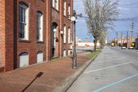 a street with two buildings in front of it and an empty street side walk next to it