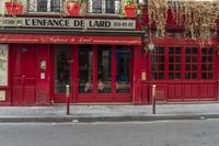 there is a large red door to a restaurant that looks like it has been cleaned