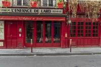 there is a large red door to a restaurant that looks like it has been cleaned