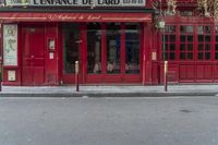 there is a large red door to a restaurant that looks like it has been cleaned