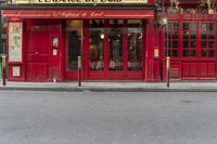 there is a large red door to a restaurant that looks like it has been cleaned