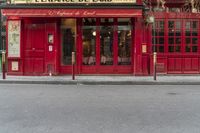 there is a large red door to a restaurant that looks like it has been cleaned