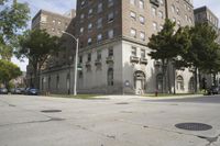a parking meter is on the sidewalk near buildings in the city that has cement floors