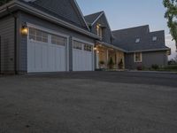 a picture of an outdoor garage in front of a house at sunset that is on sale for $ 25, 000