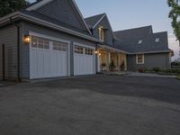 a picture of an outdoor garage in front of a house at sunset that is on sale for $ 25, 000