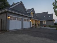 a picture of an outdoor garage in front of a house at sunset that is on sale for $ 25, 000