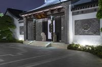 an asian looking home is illuminated by lights on the building's roof and doors