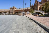 a very large building and some steps leading up to the side of a road in front of it