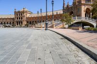 a very large building and some steps leading up to the side of a road in front of it