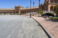 a very large building and some steps leading up to the side of a road in front of it