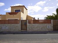 this is an outdoor image of a building and fenced off street area from the outside