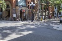 an old brick building with an awning on the outside, with no parking spaces on the sidewalk